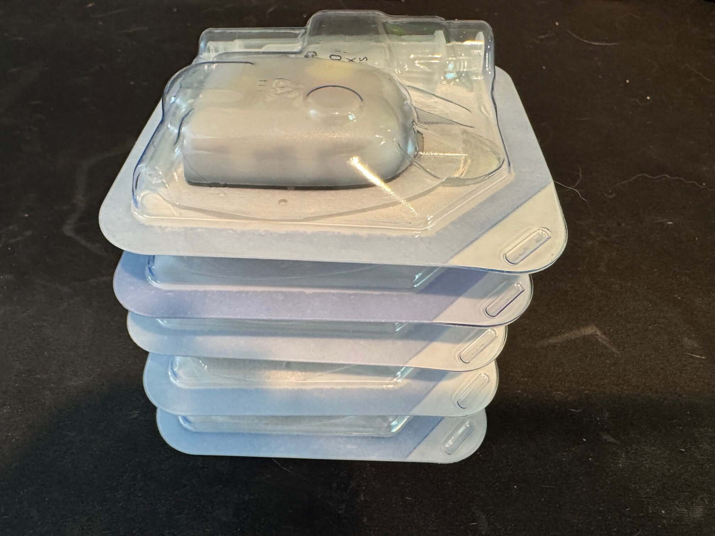 Stack of five Omnipod 5 system pods in clear packaging, compatible with Dexcom G6, no retail box.